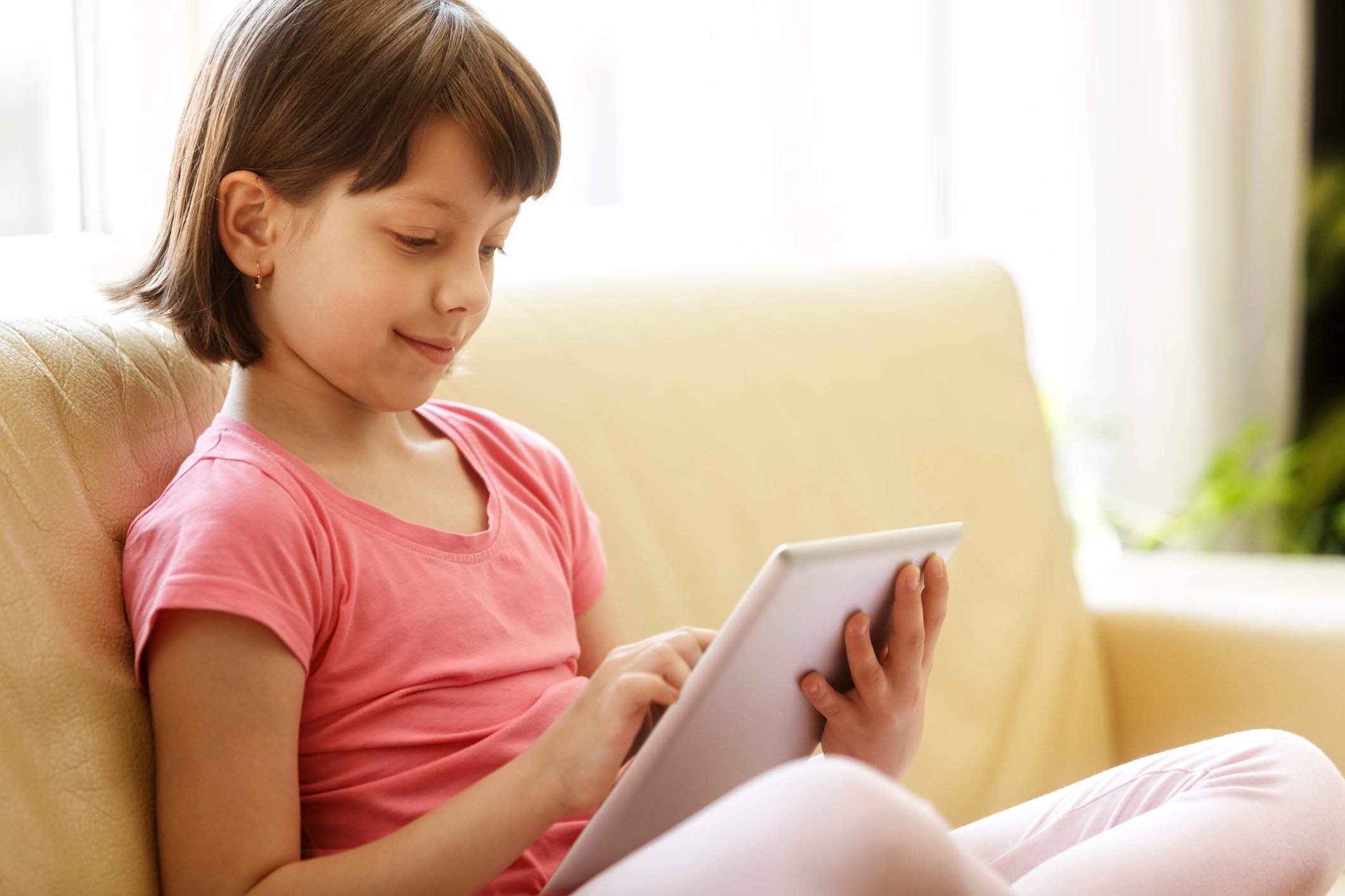 A child using a tablet.