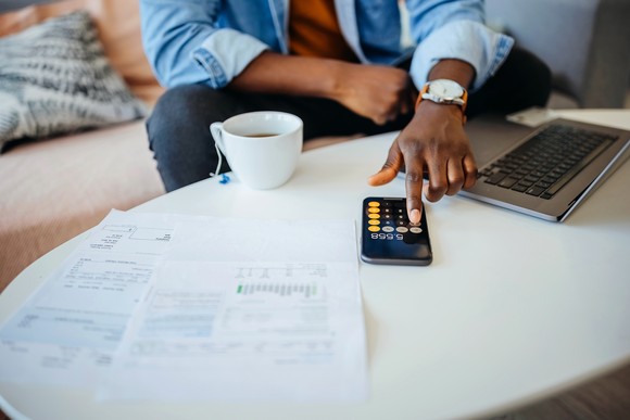 A rental owner going over taxes at a desk.