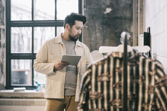 A person looking at clothes.
