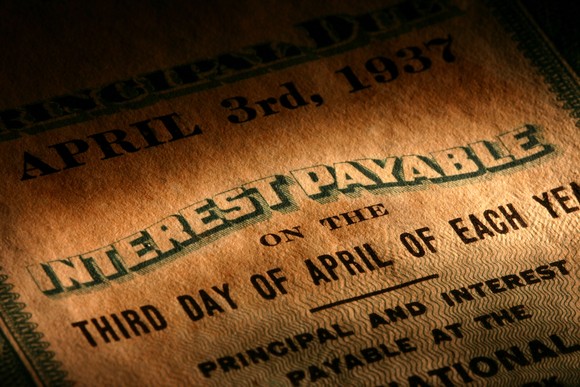 An old-style bond showing interest payable terms.