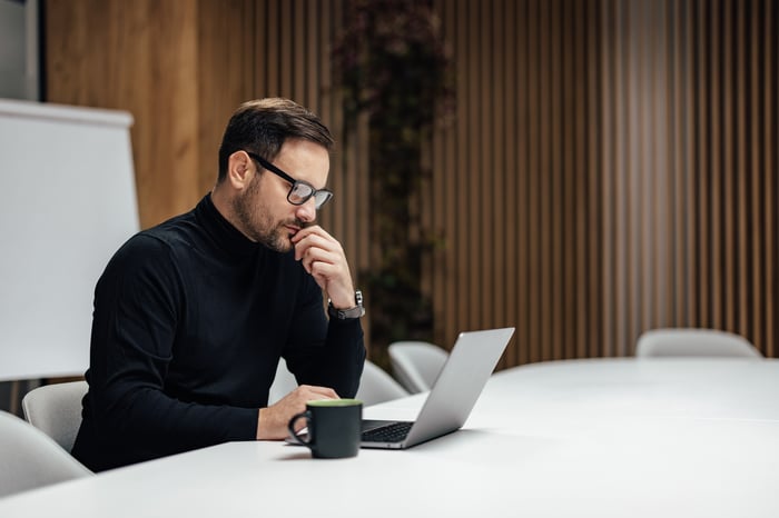 A person at a laptop.