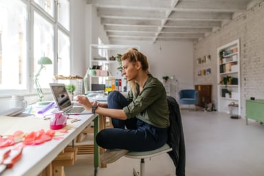 Young Lady Using Laptop at Home