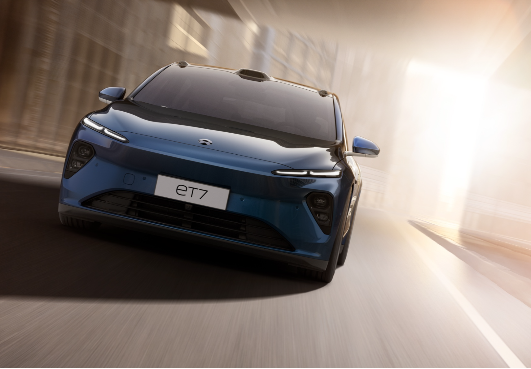 Front view of blue Nio ET7 sedan. 