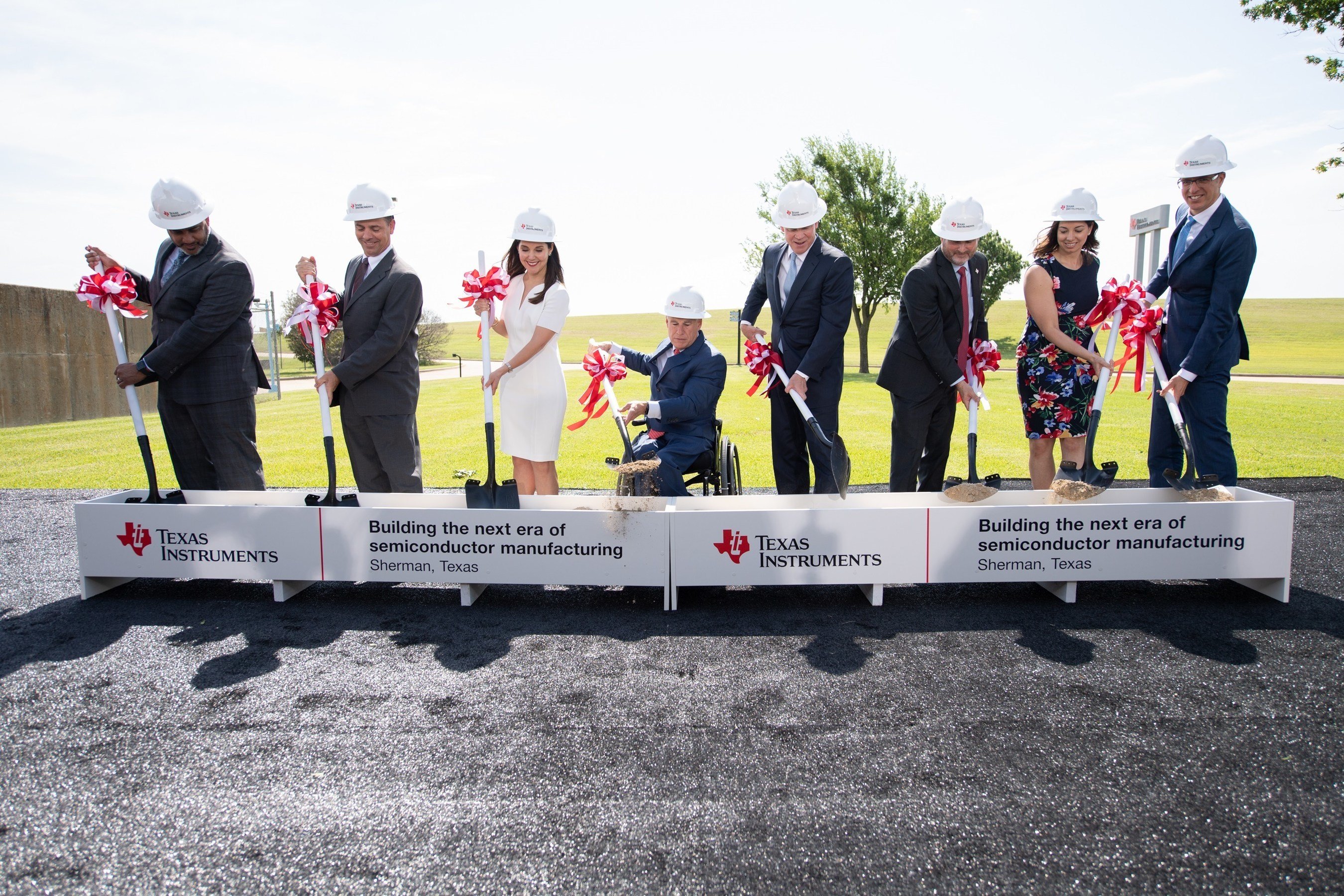 Texas Instruments executives breaking ground at a new semiconductor manufacturing plant in Texas.