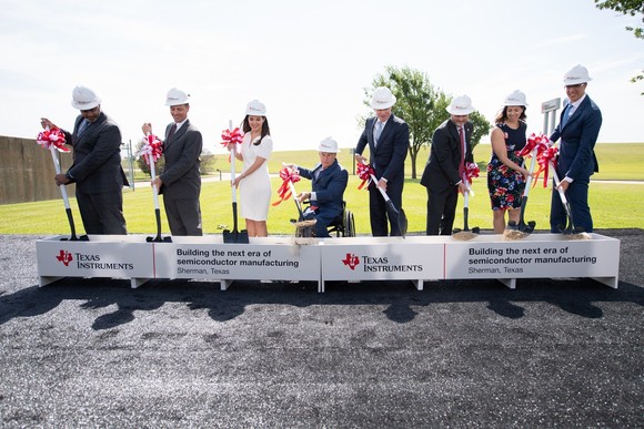 Texas Instruments executives breaking ground at a new semiconductor manufacturing plant in Texas.