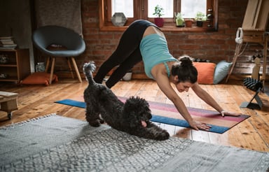 Woman Doing Yoga with Dog