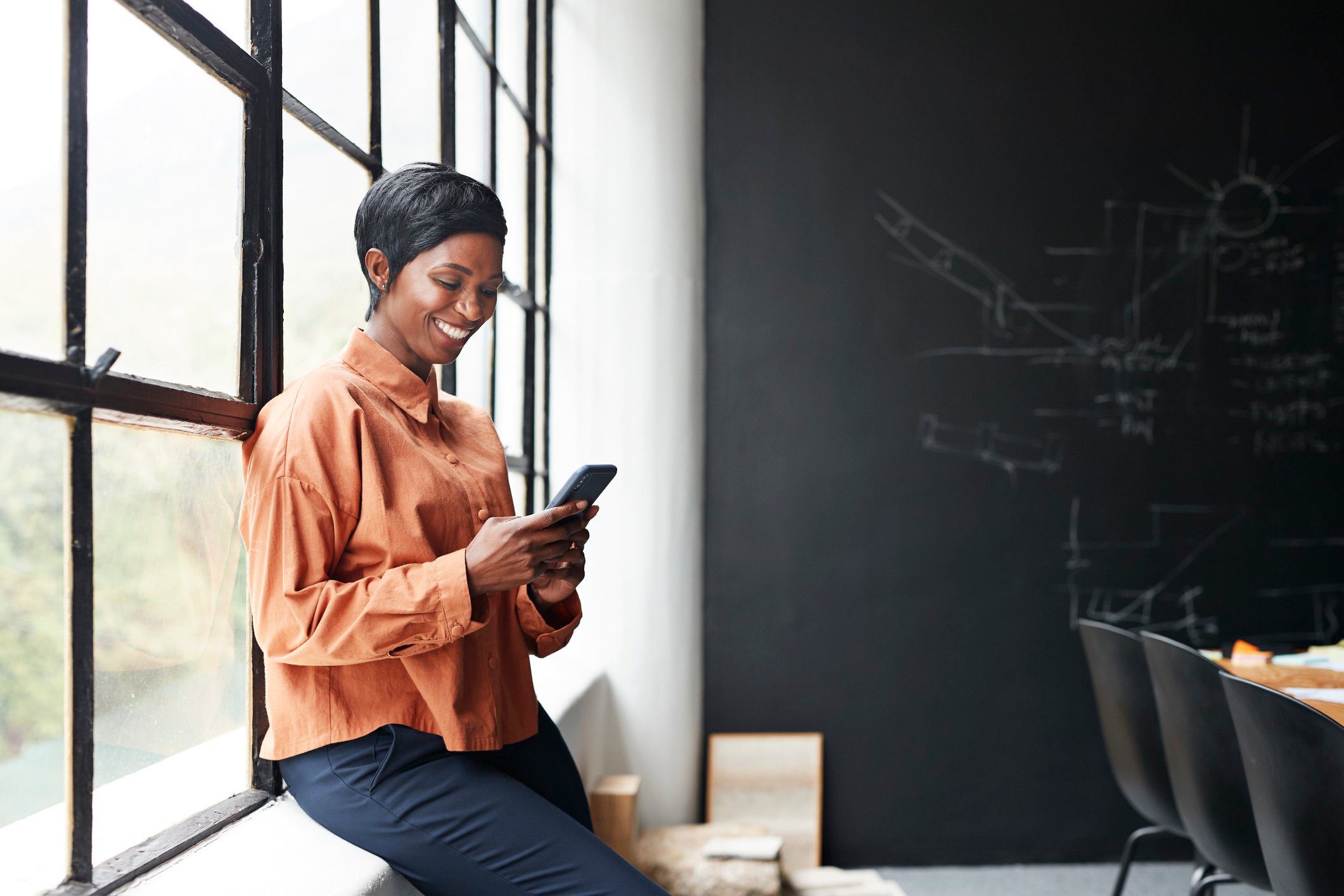 A woman looking at her phone.