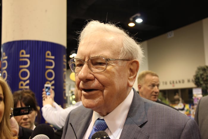 Warren Buffett speaking to reporters.