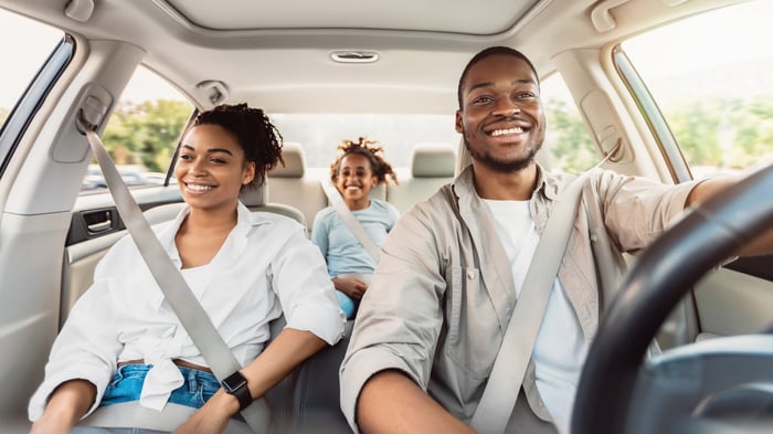 A family enjoys their newly purchased car