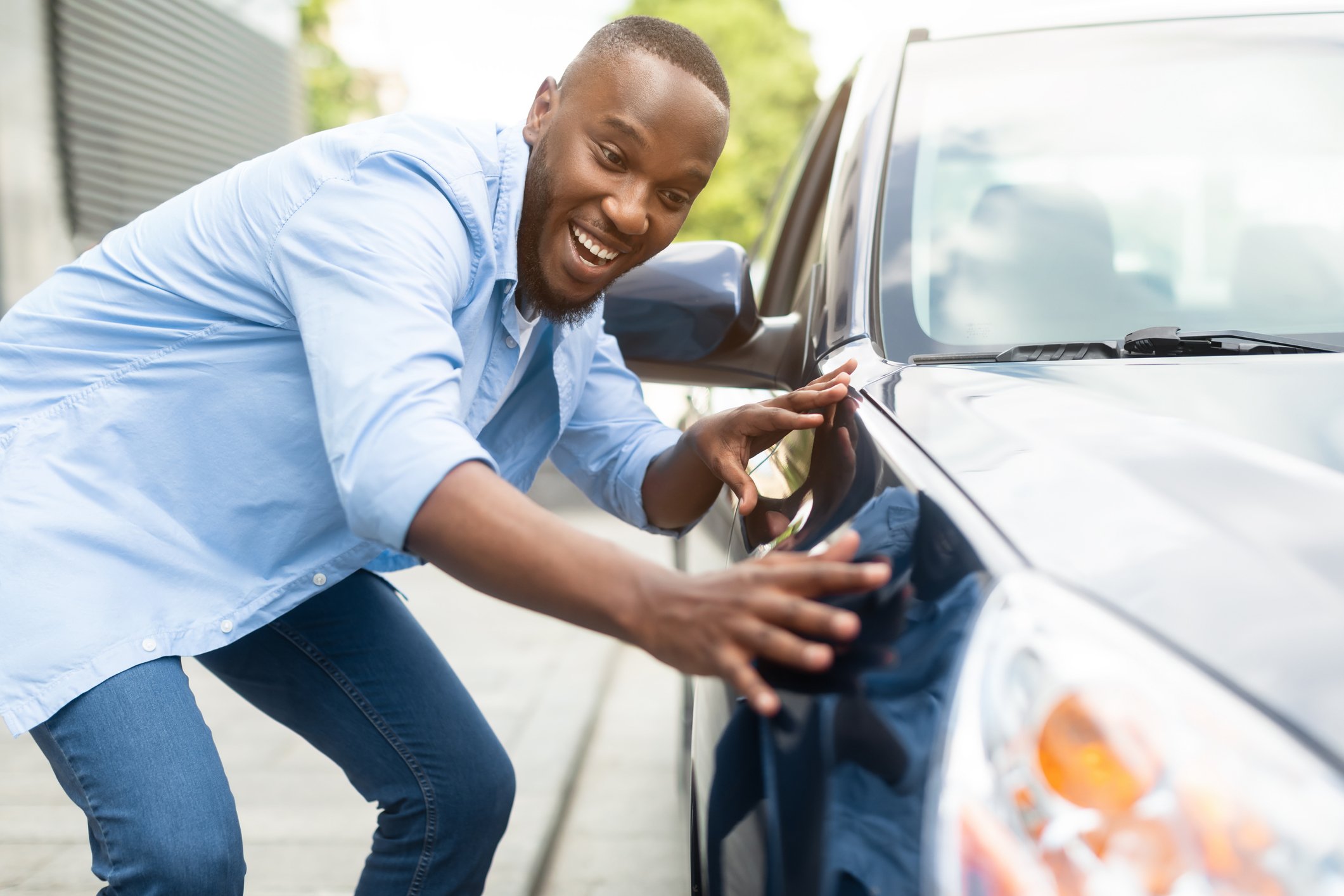 Driver admires his newly-purchased car