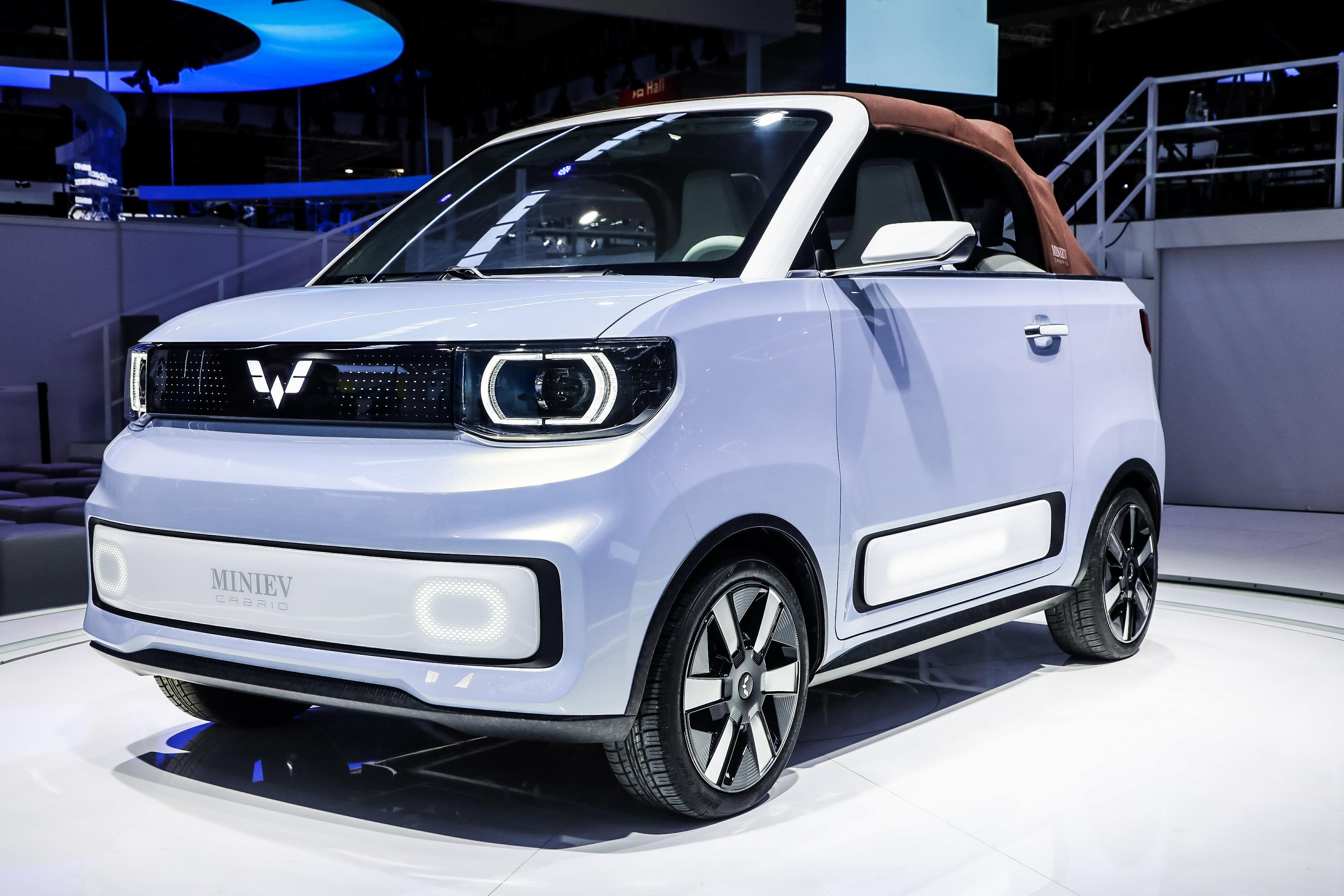 A Wuling Hong Guang Mini Cabrio EV on display during an auto expo. 