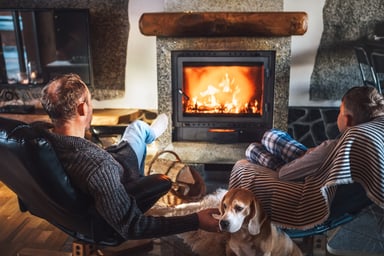 two people infront of a fireplace