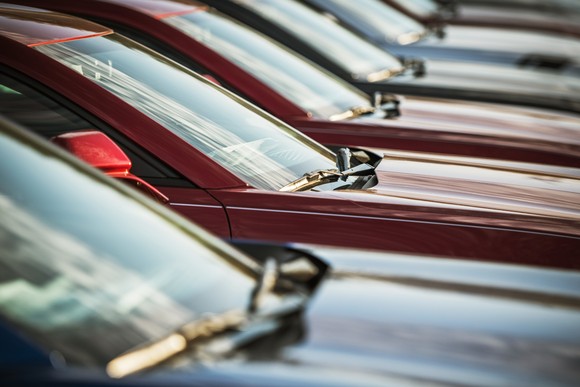 Windshields of cars in a row.