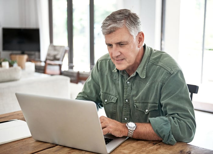 A person at a laptop.