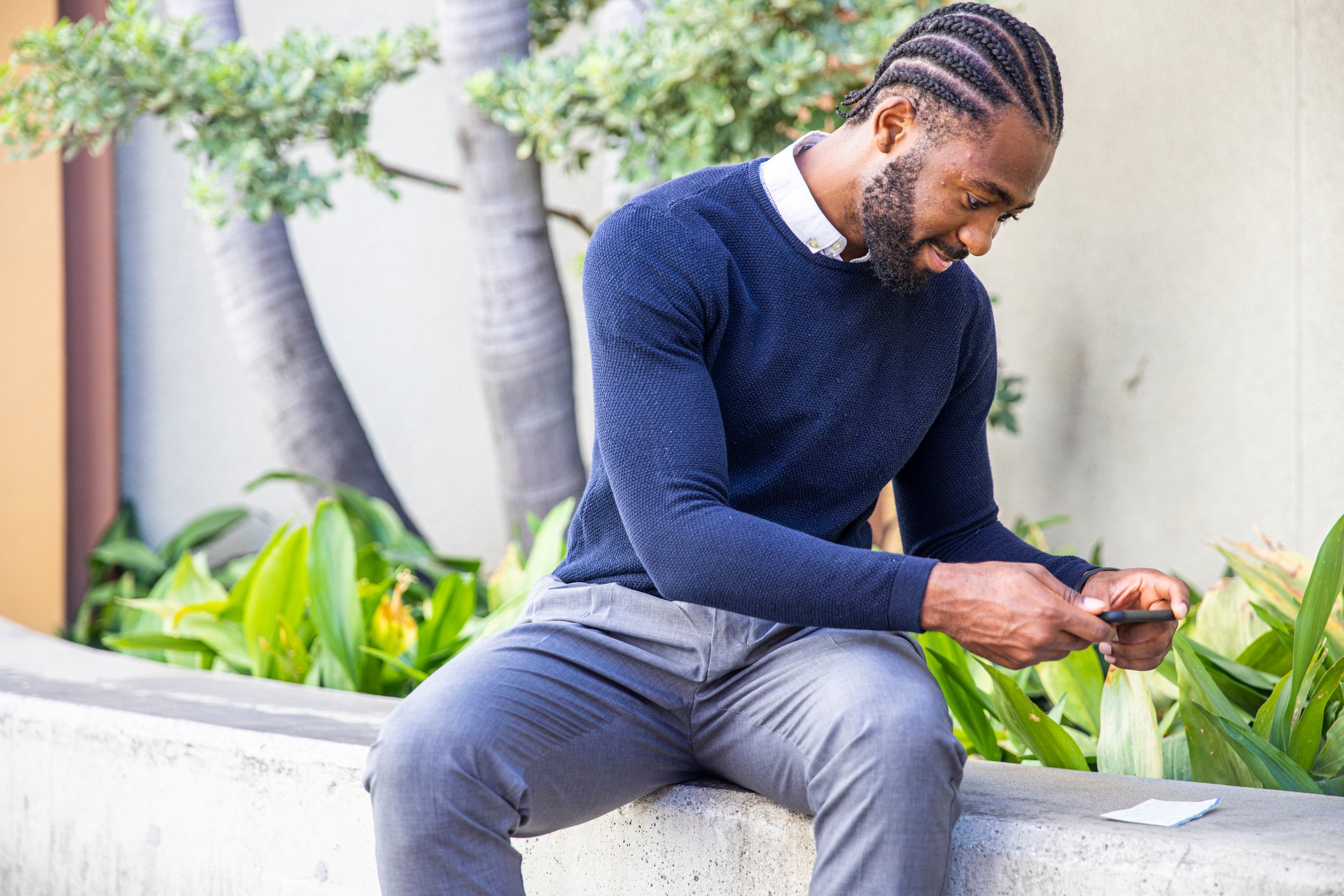 A person taking a picture of a check using a smartphone.