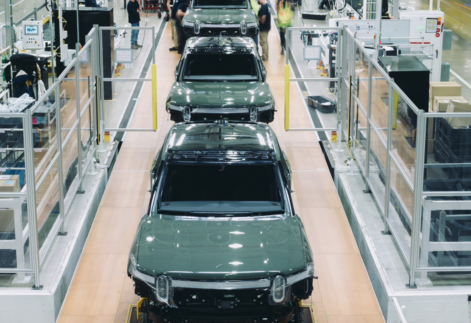 Production line of green Rivian pickup trucks at its Illinois plant.
