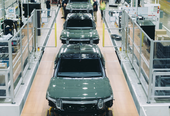 Production line of green Rivian pickup trucks at its Illinois plant.