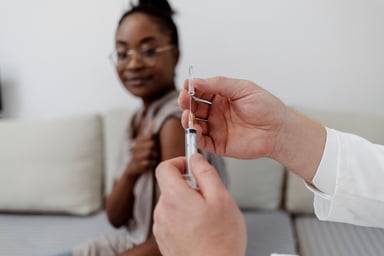 doctor loads syringe in front of patient