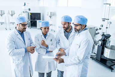A team of scientists reviewing results in a lab.