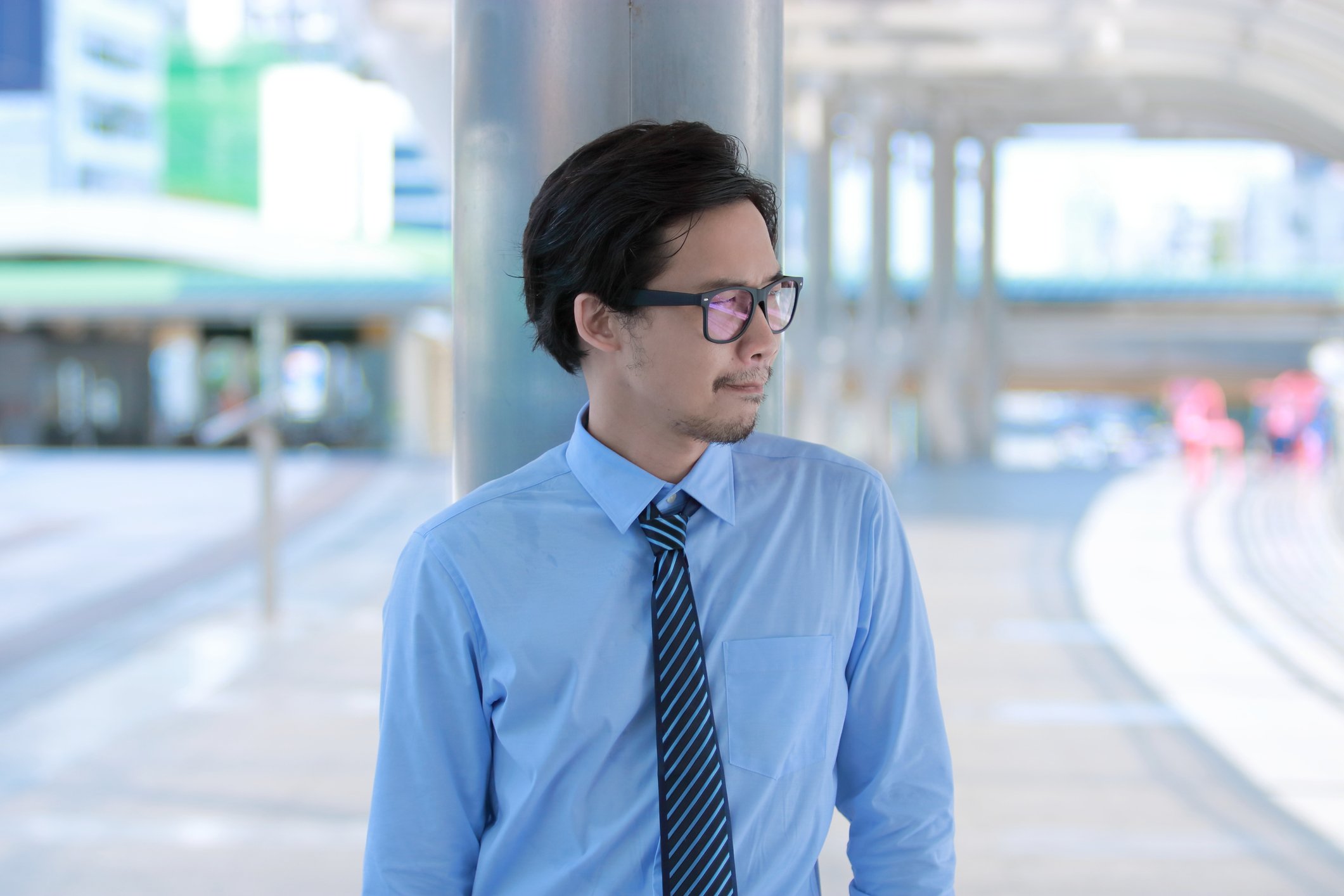 Business person in an office, looking off