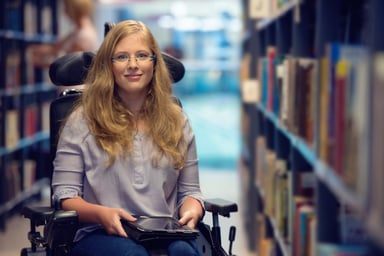 Getty - person in library stacks books reading