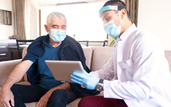 A doctor explains test results to a patient.