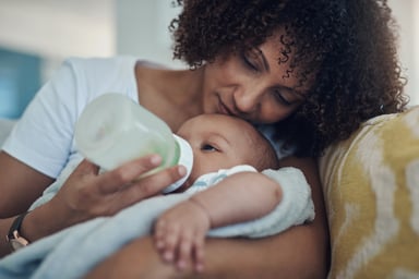 Person feeding their baby
