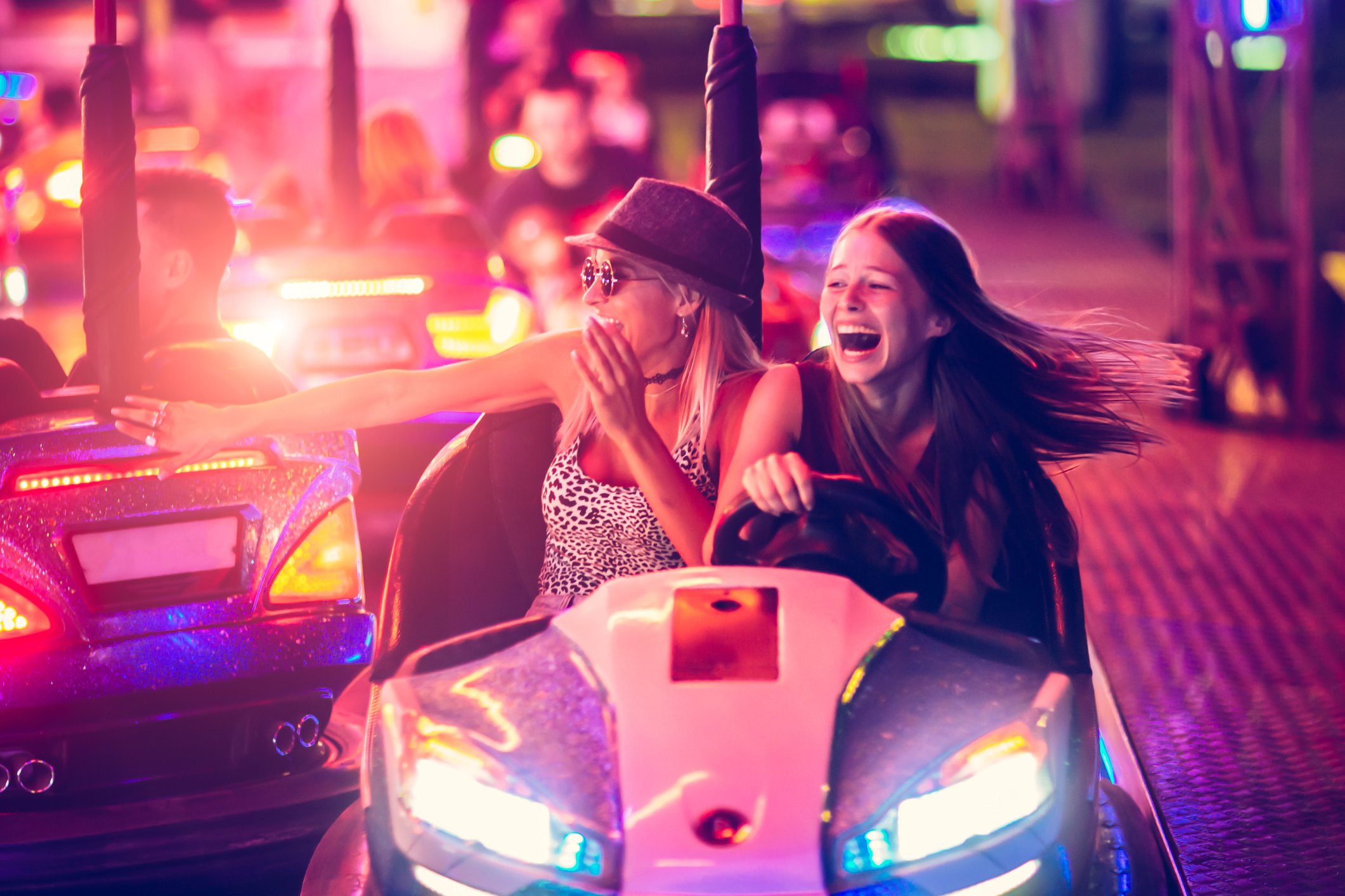 Two people in a bumper car.