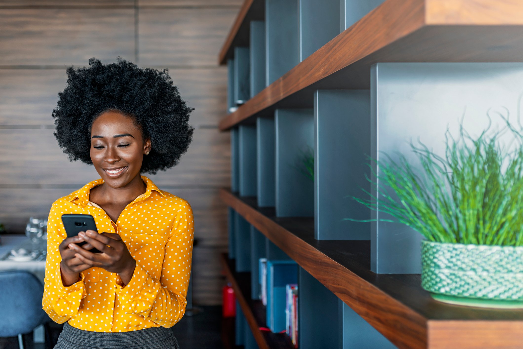 Smiling After Being Approved on Phone