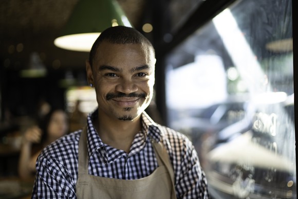 Restaurant worker in kitchen. 