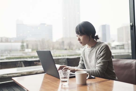 A woman using a computer.