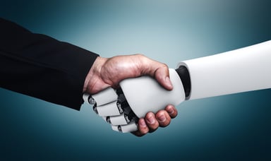 human and robot shaking hands
