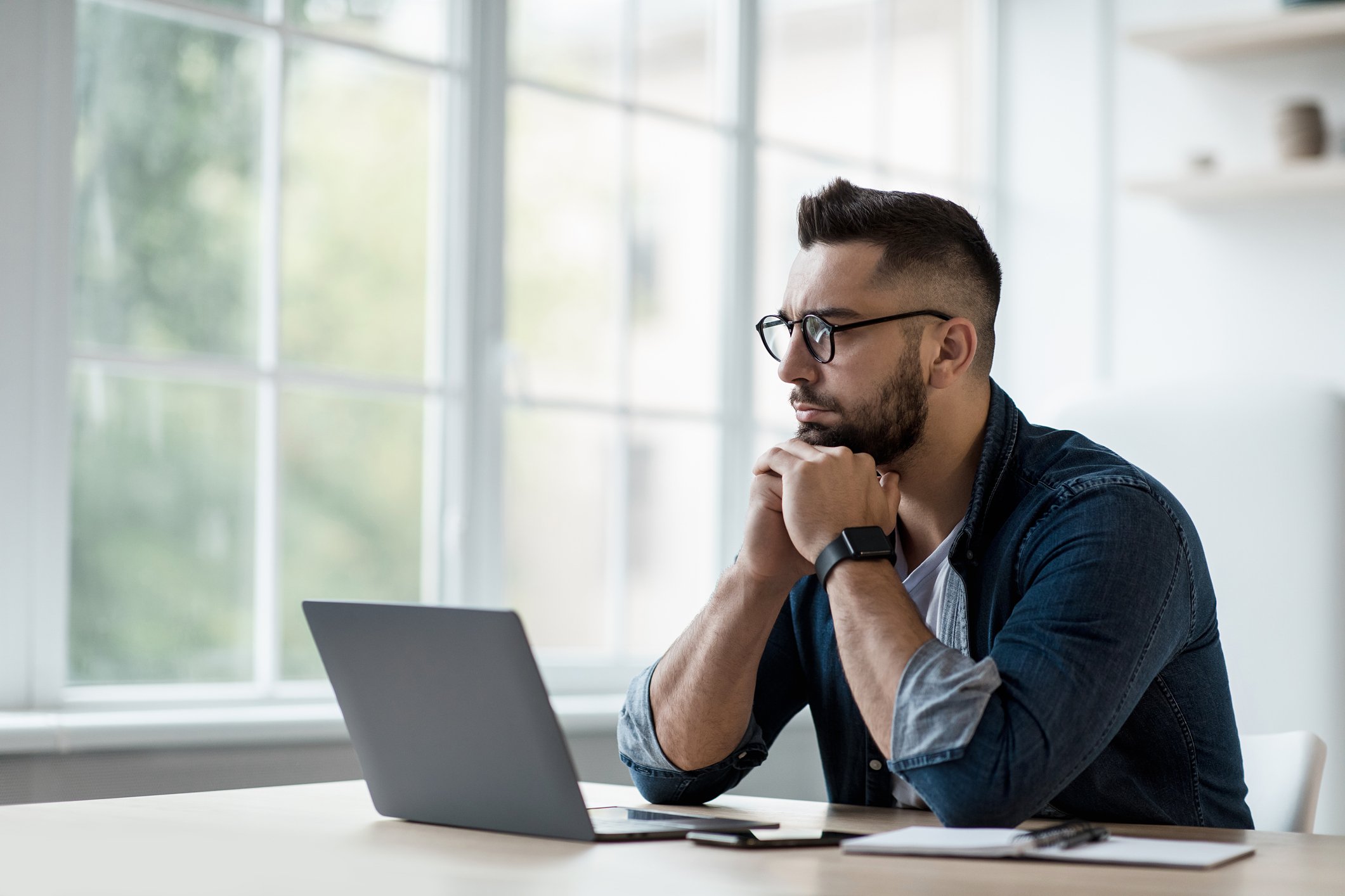 A person at a laptop.
