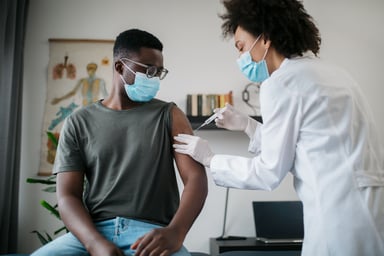 Vaccine - doctor giving a shot to a patient