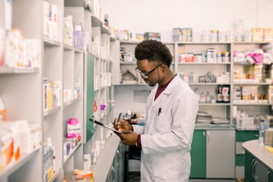 Pharmacist reviewing checklist.