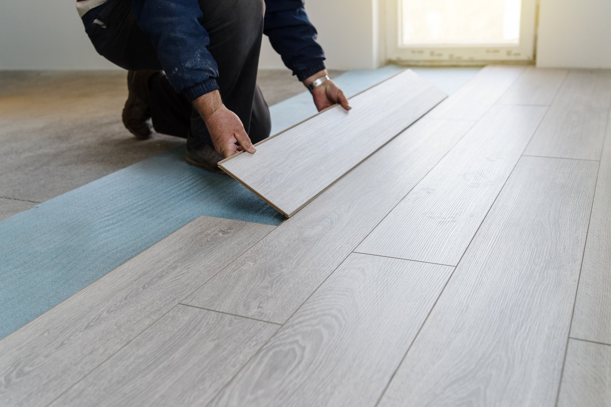 Carpenter doing laminate floor work