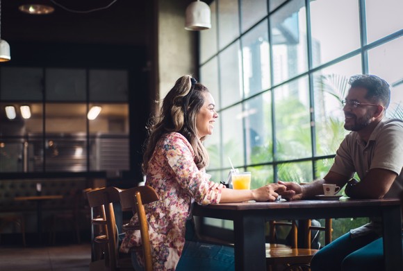 Two people having breakfast in a cafe.