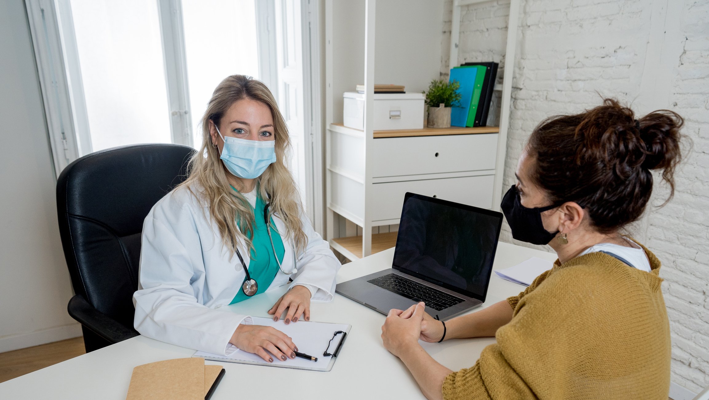 A doctor and patient at an appointment.