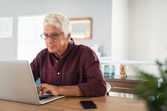 A person at a laptop.