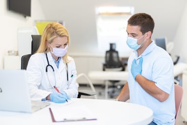 A patient at an appointment with their doctor