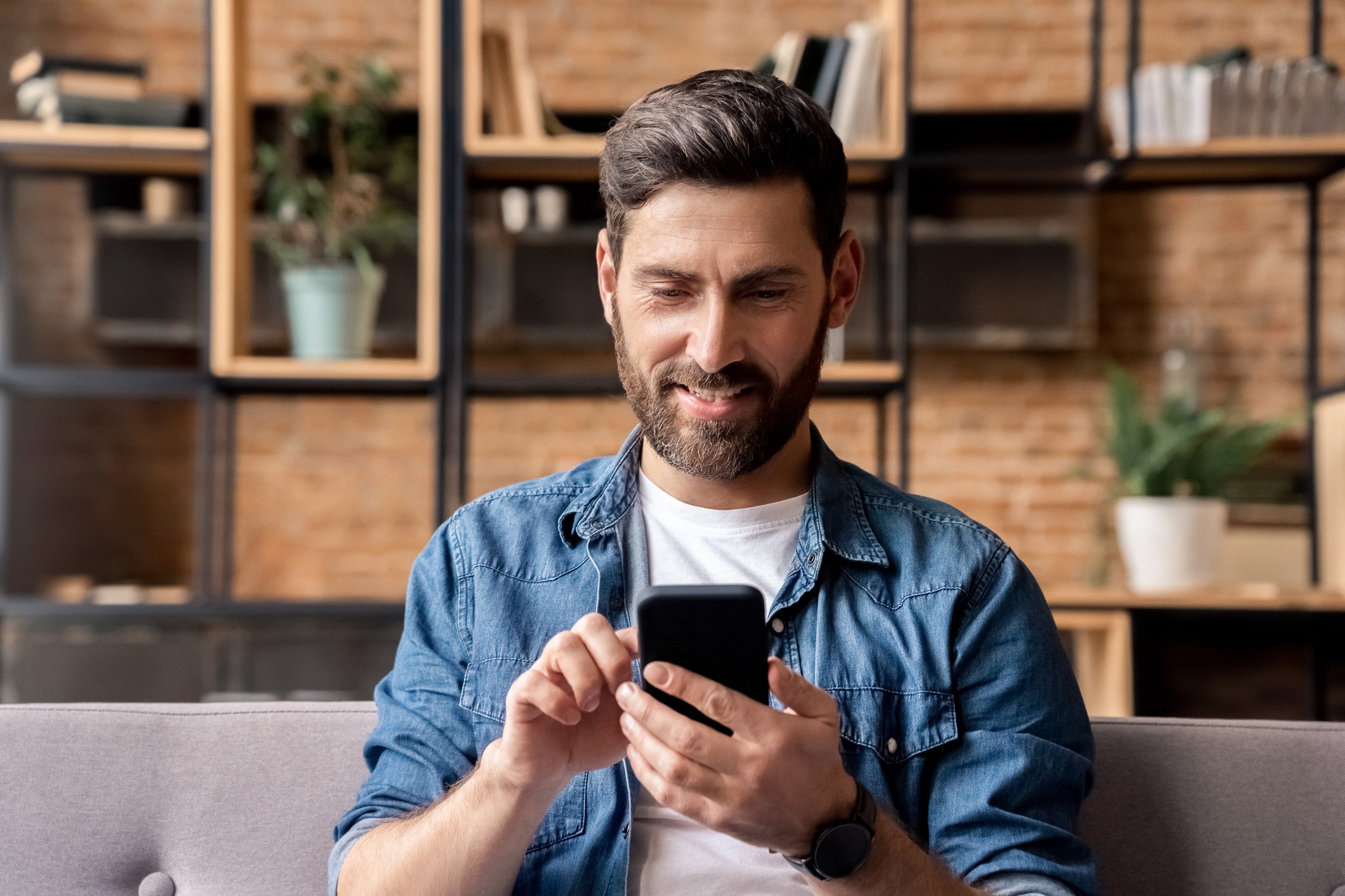 GettyImages-investor-stocks-growth-phone