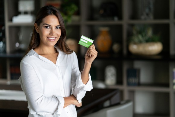 A person holding a credit card.