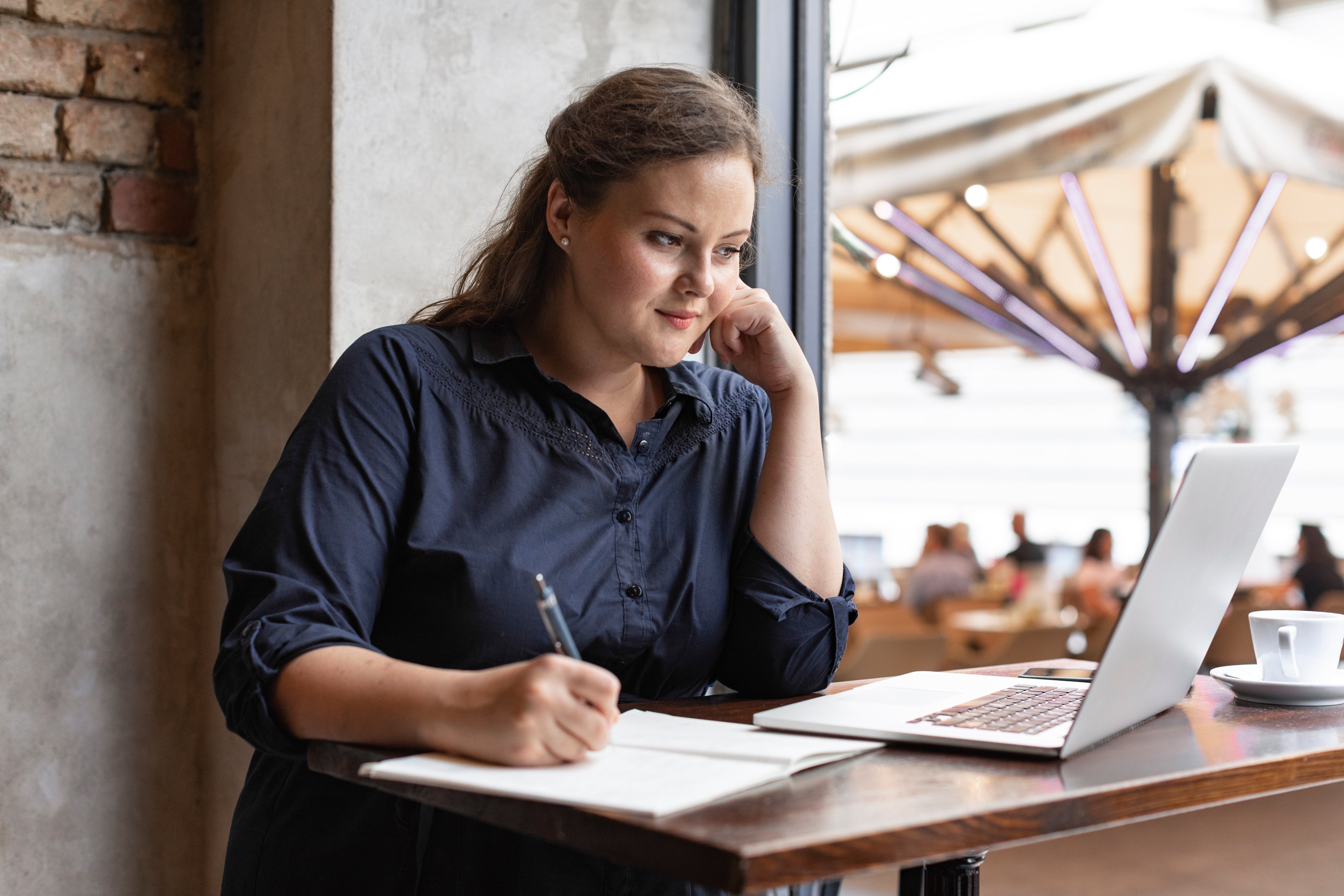 businesswoman remote work from cafe