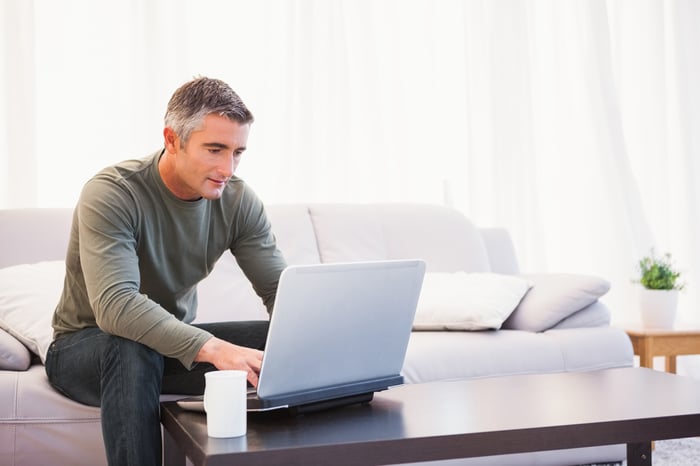 A person at a laptop.