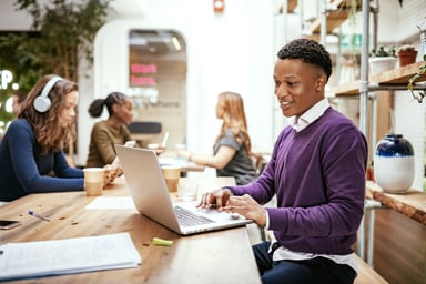 People working in a cafe.