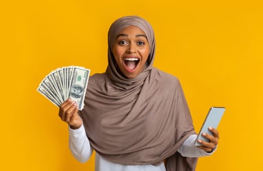 investor excited holding money smartphone
