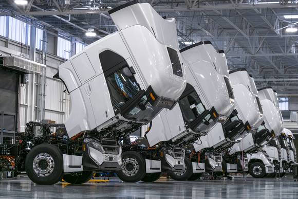 Nikola electric semi trucks in manufacturing plant.