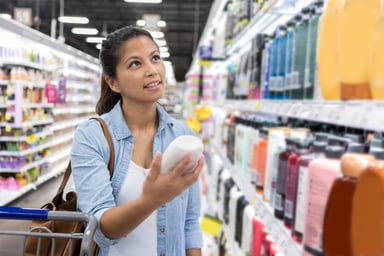 Woman Shopping for Toiletries at Supermarket