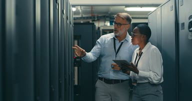 2 technicians and data center racks