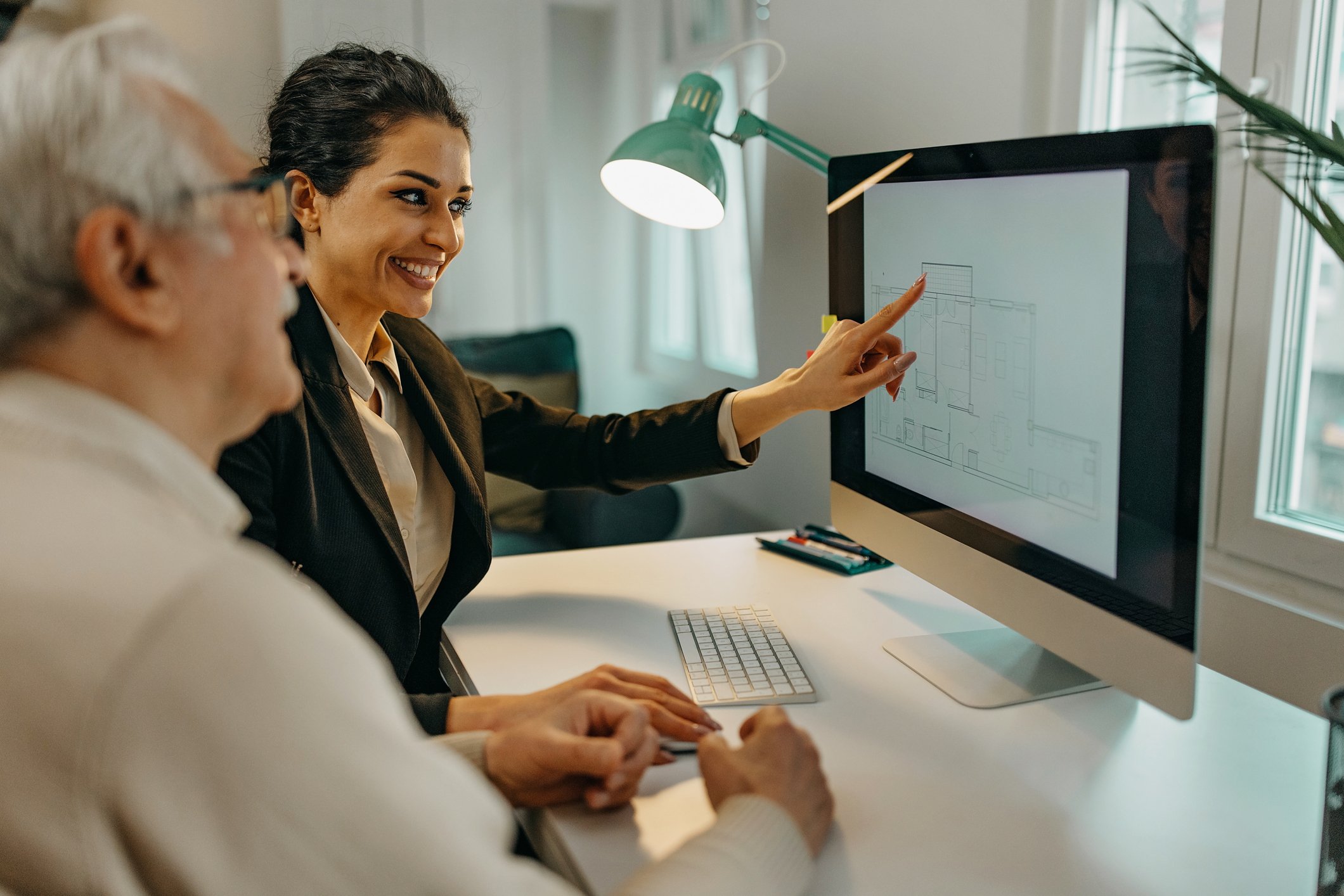 Investment advisor showing a client stock charts.